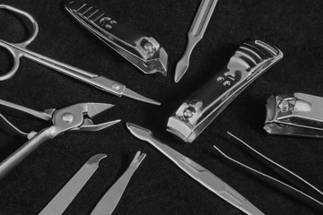Minimal manicure set on a black background.