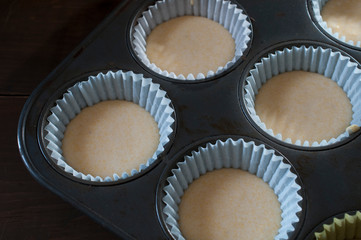 dough for cupcakes, cornmeal cupcakes ready to bake close up image of dark food