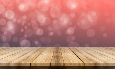 Empty wooden table with a beautiful colour bokeh background