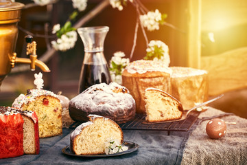 Traditional russian Easter cottage cheese dessert. Orthodox paskha, kulich cakes on table.