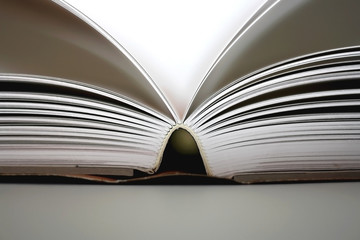 Big open book. Selective focus, close-up.