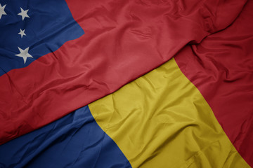 waving colorful flag of romania and national flag of Samoa .