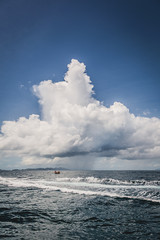 ocean with rain clouds in the tropics