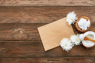 Organic healthy Coconut butter and fresh coconut pieces on wooden background copy space with empty blank