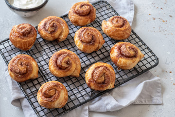 Puff pastry cinnamon rolls on a tray