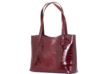 women's red leather bag on the back isolated on a white background