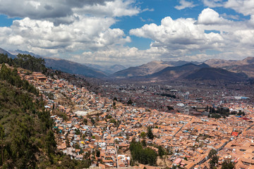 Fototapeta premium Red brick roofs. Colonial town. Panorama view historical center Cusco Peru 