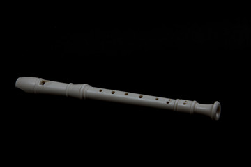 recorder flute isolated on black background flat lay. Horizontal image.