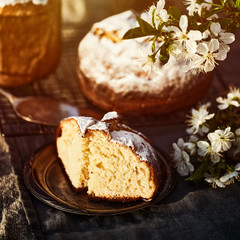 Traditional russian Easter cottage cheese dessert. Orthodox paskha, kulich cakes on table.