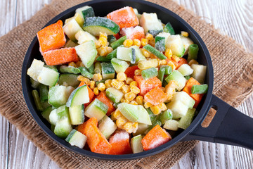 Mix of frozen vegetables in the pan