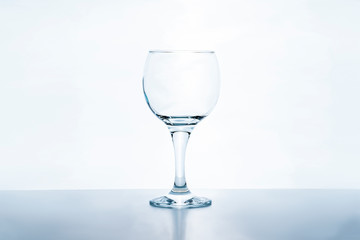 Empty wine glass on white background