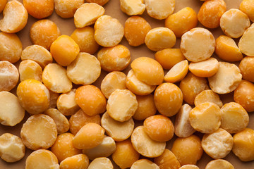  Dry yellow peas close-up for the whole frame. Layout for grocery departments, packaging of peas. Food photo for vegans.
