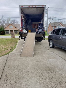 Moving Truck In Driveway.