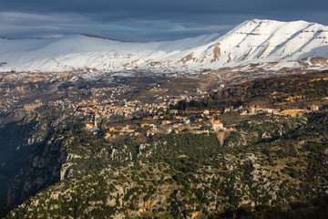 Spring in Kadisha valley Lebanon snowy mountains sunset
