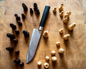 Chess pieces and knife