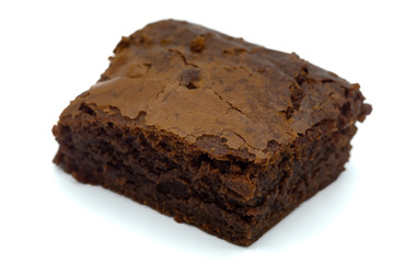 A close up of a chocolate brownie cake isolated on a white background