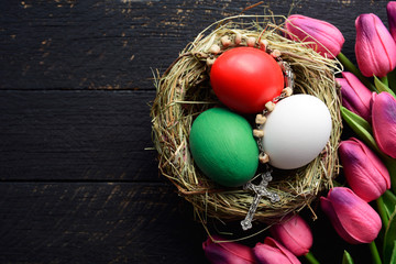 Happy Easter holiday Italian card, Easter eggs as the color of the Italy flag in nest