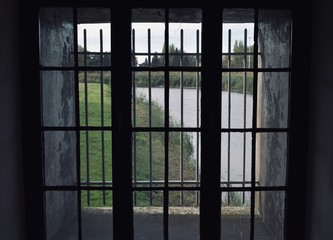 Looking outside through a prison window