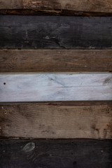 background of parallel boards of different colors with a white board in the middle