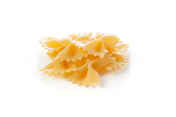 Farfalle pile - dry pasta isolated on a white background . A variety of types and forms of Italian pasta.