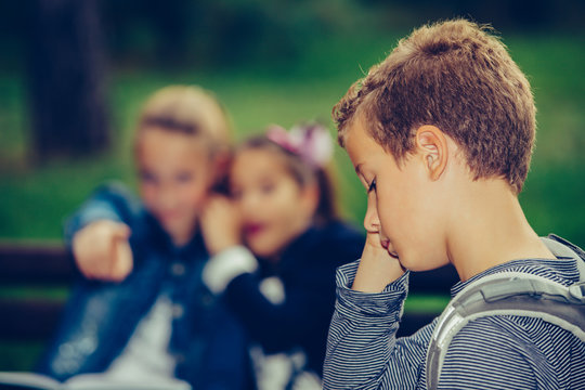 Sad Boy Feeling Left Out, Teased And Bullied By His Classmates.