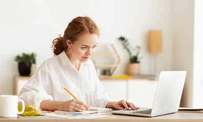 Tailor using personal computer laptop at home