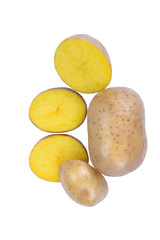 Whole potatoes and cut slices on white background with clipping path. Fresh raw vegetables, macro photography