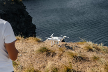 Young people are preparing a drone for flight. Drone setup