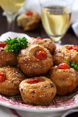 Muffins with cheese, cottage cheese and tomatoes, vegetables and cheese served with wine.