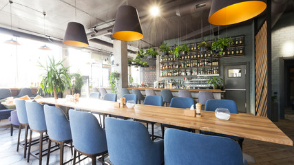 View on bar counter from tables in modern cafe
