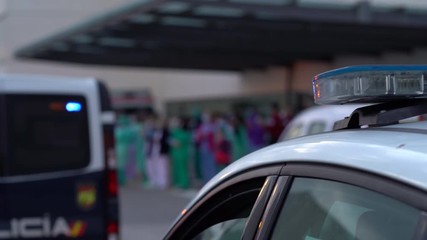 Security forces and police supporting doctors and nurses in the fight against the coronavirus. Selective focus. Defocused background. - Powered by Adobe