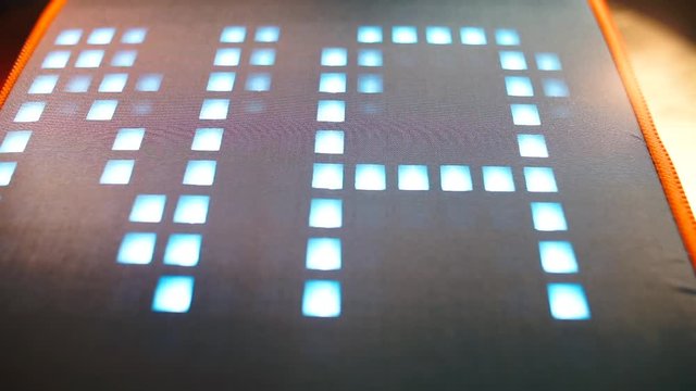 The word dominatrix is written on the screen in large pixel letters in motion. The concept of information signs and symbols.