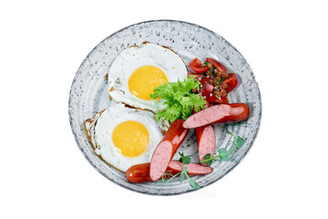 fried eggs with sausage and vegetables