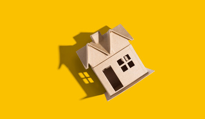 Cardboard house with drop shadow overhead view