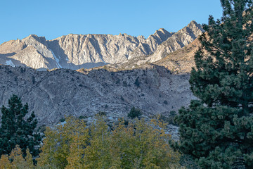 mountain range peaks and valleys with morning sun glow