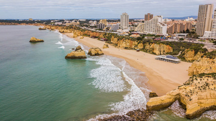 Aerial view of Três Castelos beach, Portimão city. Beautiful beach in Algarve, Portugal