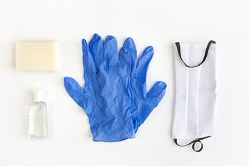Items for coronavirus protection: mask, soap, hand sanitizing gel and latex medical gloves