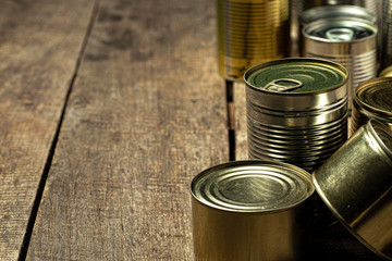Tin cans with food on the table. Close up.