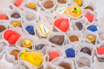 A lot of delicious multi-colored sweets. Close-up.
