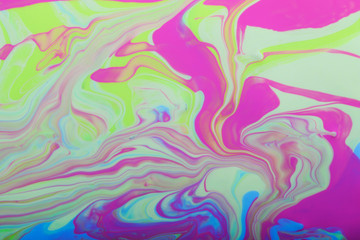 Pastel marble background.Mixed nail polishes-pink and blue.Beautiful stains of liquid nail polish.Modern backdrop.Fluid art technique.Good for placing text or design.Pour painting art work.