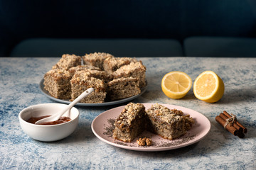 Homemade poppy seeds pie with with ingredients for baking on a rustic table, breakfast or dessert, traditional poppy pie with chopped walnuts and apricot jam