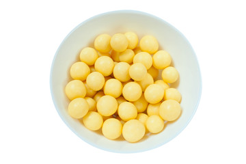 tasty appetizing sweets in white chocolate on a plate on  white table