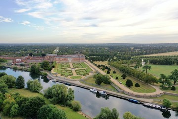 Scenic View of Hampton Court Palace with Beautiful Gardens and the City Behind