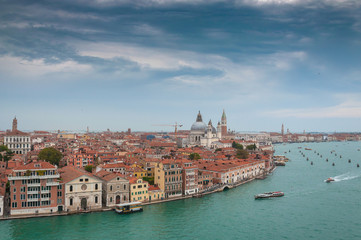 Fototapeta na wymiar Venice aerial view from Giudecca channel in a cloudy day, Venice, Italy. Concept: historic Italian places, evocative and little-known views of Venice