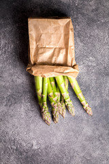 Fresh green asparagus in a paper bag. Healthy eating concept.