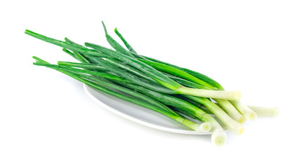 Green onion on the plate isolated on white