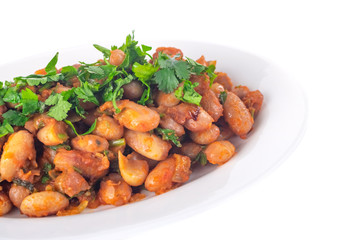 Lobio is a Georgian dish and parsley in a plate isolated on white