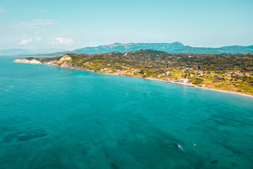 Fototapeta na wymiar Aerial top view of summer beach and sea.Free space for your decoration and sunny warm day.Corfu island of Greece. 
