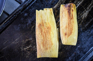 Sweet mexican tamales warming over the pan