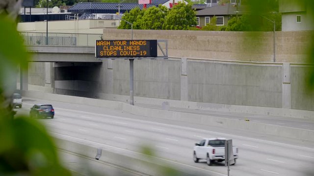 ELECTRONIC FREEWAY MESSAGE BOARD REGARDING COVID-19 / CORONA VIRUS.  4K, NO PEOPLE.